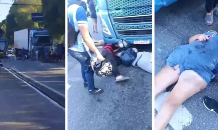 Garupa de moto vai parar debaixo de carreta após colisão na Avenida Fernandes Lima, em Maceió